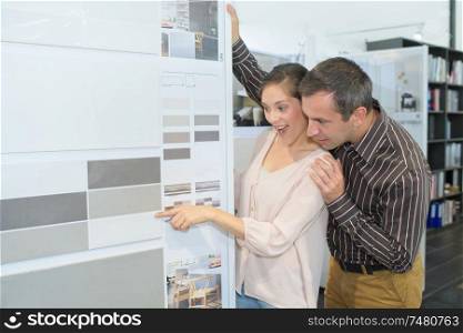 family couple shopping in kitchen store