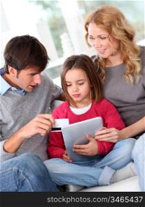Family doing online shopping with tablet