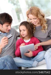 Family doing online shopping with tablet