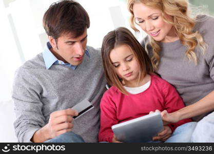 Family doing online shopping with tablet