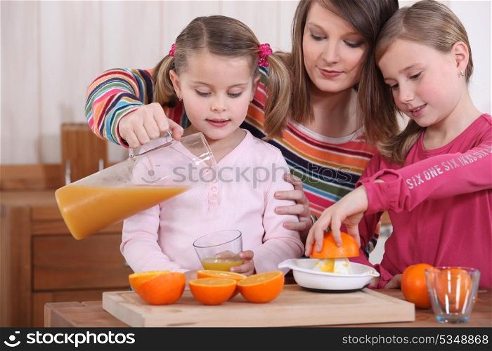 Family drinking fresh orange juice