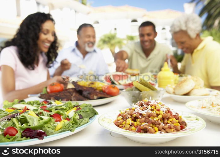 Family Eating An Al Fresco Meal