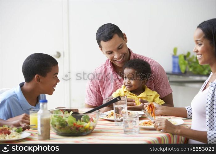 Family Eating Meal Together At Home