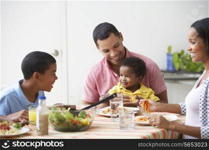 Family Eating Meal Together At Home