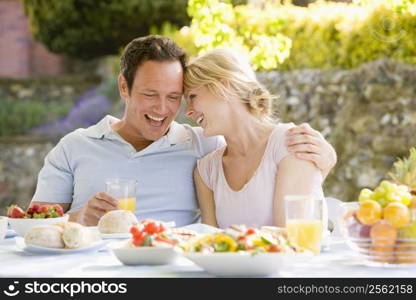 Family Enjoying A Barbeque