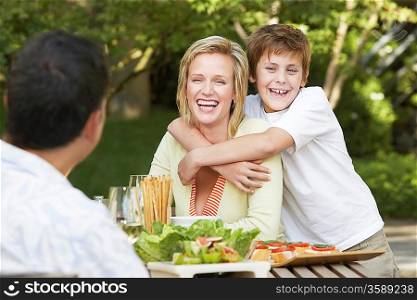 Family Enjoying a Meal Outdoors
