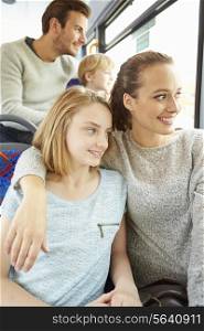 Family Enjoying Bus Journey Together