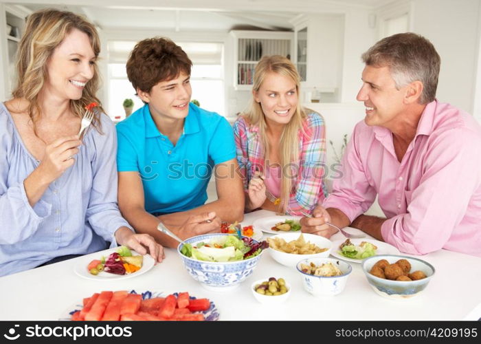 Family enjoying meal at home