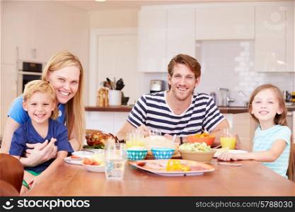 Family Enjoying Meal At Home Together