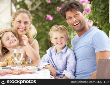 Family Enjoying Meal outdoorss