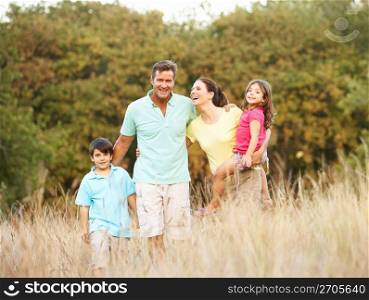 Family Enjoying Walk In Park