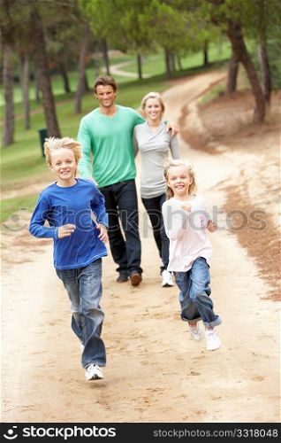 Family enjoying walk in park