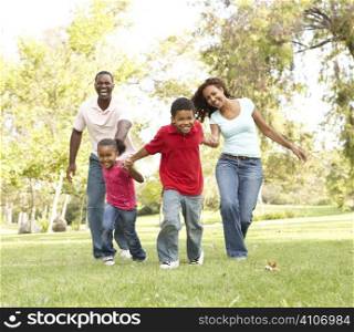 Family Enjoying Walk In Park