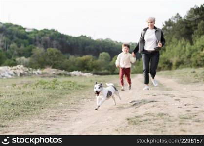 family enjoying walk park with dog