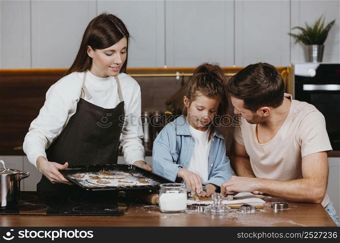 family father mother with daughter cooking together home