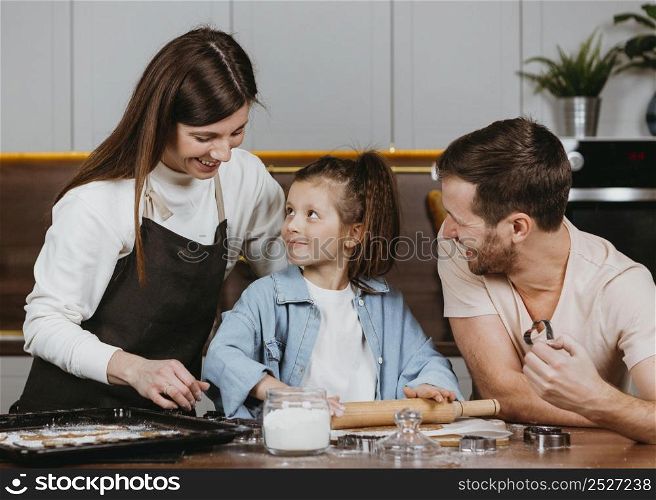 family father mother with daughter cooking together kitchen