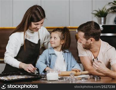 family father mother with daughter cooking together kitchen