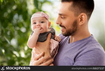 family, fatherhood and people concept - close up of father with little baby daughter. close up of father little baby daughter