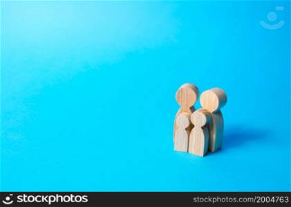 Family figures of parents and kids on a blue background. Family values and health. Adoption and custody of children. Social support, demography, sociology. Upbringing and education. Together concept