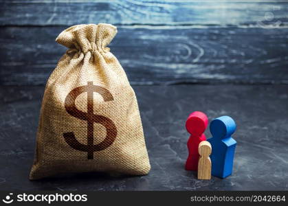 Family figurines and dollar money bag. Social assistance and support. Income level, budget. High debt. Social research, consumer preferences. Segmentation. Marketing and targeting. Demographic grant.
