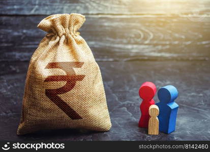 Family figurines and indian rupee money bag. Social assistance and support. High debt. Social research, consumer preferences. Segmentation. Marketing and targeting. Demographic grant. Income level