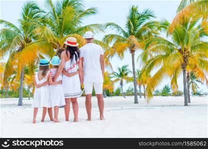 Family fun. Parents with kids on the beach. Young family on vacation have a lot of fun