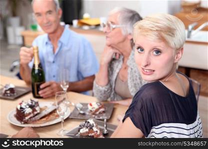 Family gathered around table