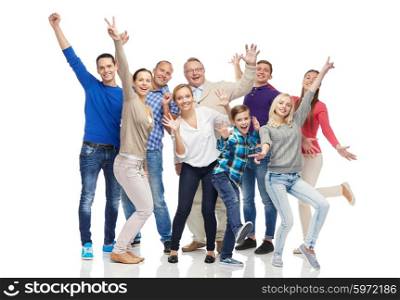 family, gender, generation and people concept - group of smiling men, women and boy having fun and waving hands