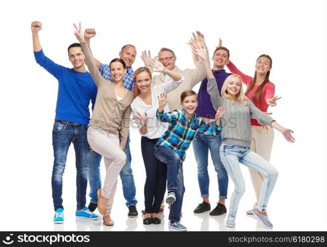 family, gender, generation and people concept - group of smiling men, women and boy having fun and waving hands