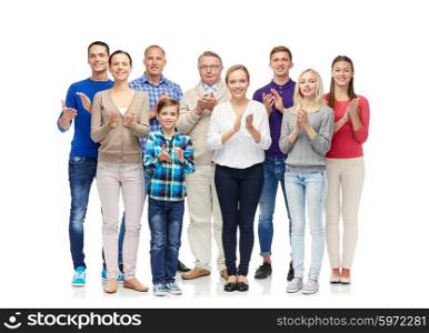 family, gender, generation and people concept - group of smiling men, women and boy applauding