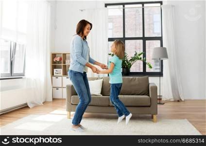 family, generation and people concept - happy smiling mother and daughter having fun at home. mother and daughter having fun at home