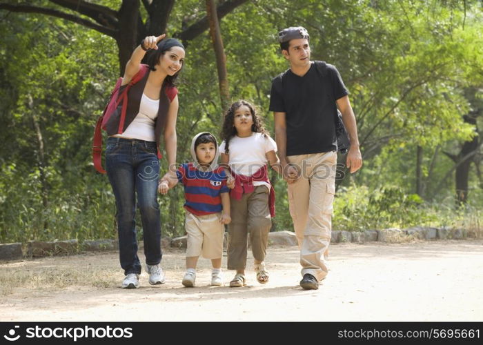 Family going for a walk in a park