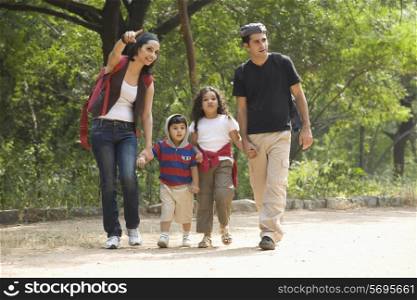 Family going for a walk in a park
