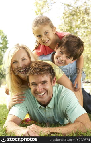 Family Group Having Fun In Park