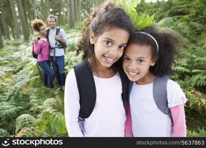 Family Group Hiking In Woods Together