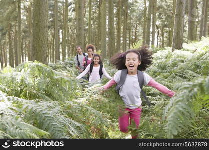 Family Group Hiking In Woods Together