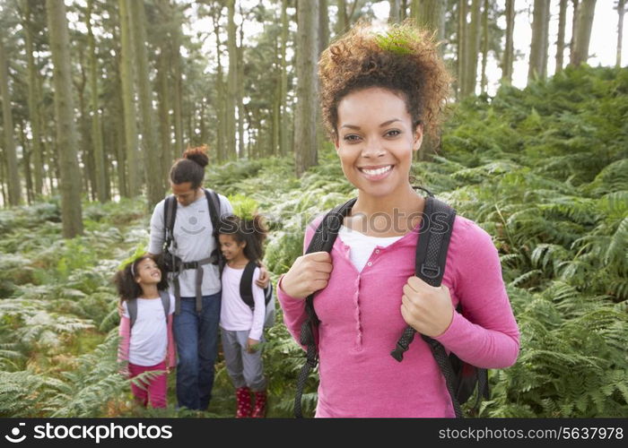 Family Group Hiking In Woods Together