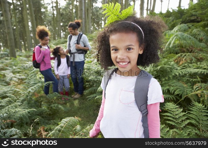 Family Group Hiking In Woods Together