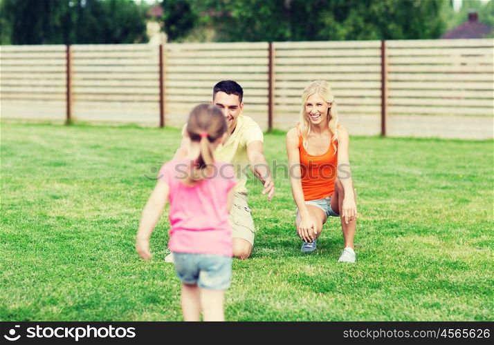 family, happiness, adoption and people concept - happy little girl running towards father and mother outdoors