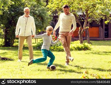 family, happiness, generation, home and people concept - happy family playing football in front of house outdoors