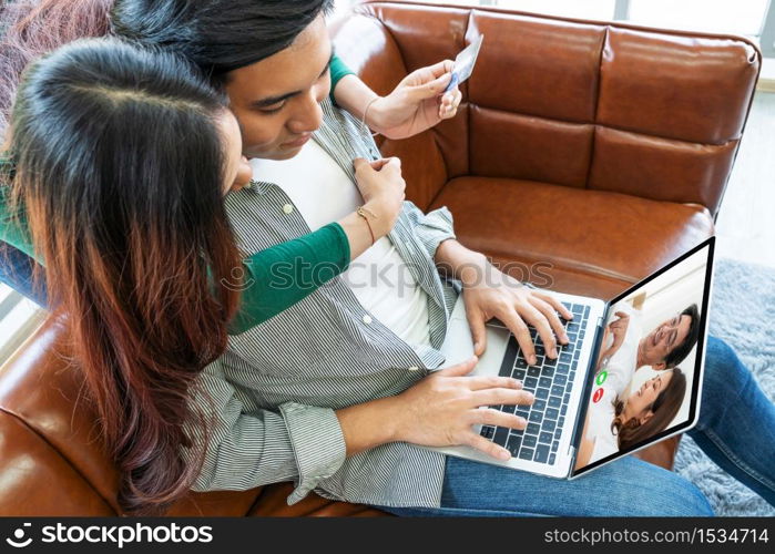 Family happy video call while stay safe at home during covid-19 coronavirus outbreak. Concept of people connection call technology with online video camera.