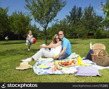 Family having a picnic in the garden