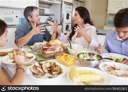 Family Having Argument Sitting Around Table Eating Meal