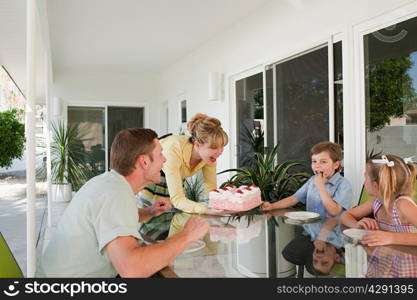 Family having birthday cake