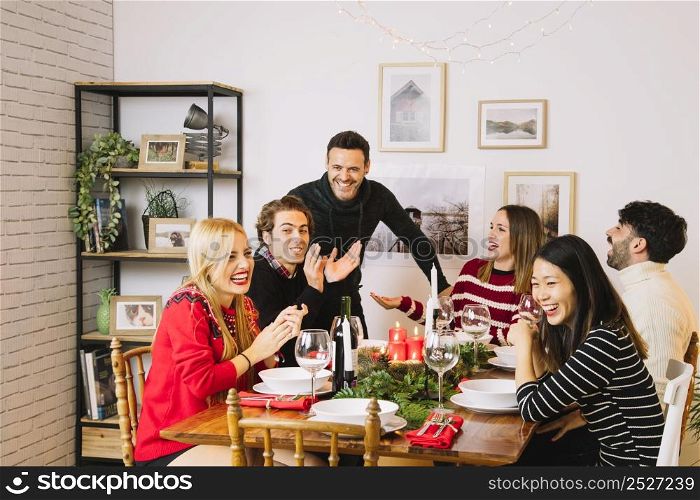 family having christmas dinner table