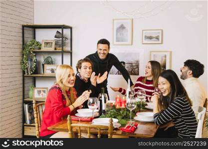 family having christmas dinner table