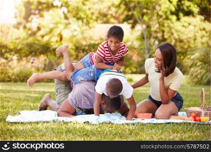 Family Having Fun In Garden Together