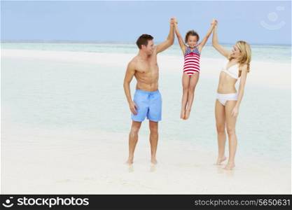 Family Having Fun In Sea On Beach Holiday
