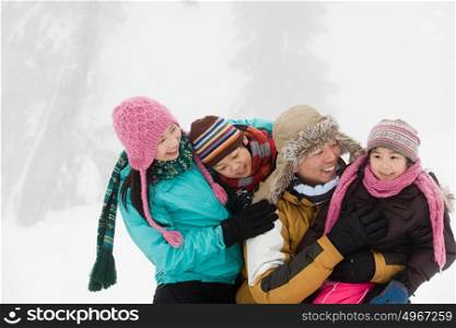 Family having fun in winter