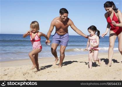Family Having Fun On Beach